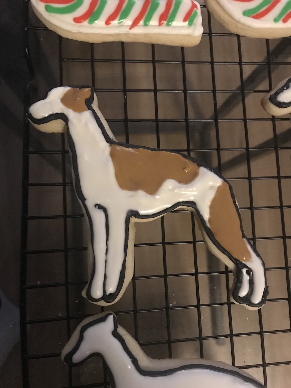 Marbling the whippet cookie icing to make a brindle patch