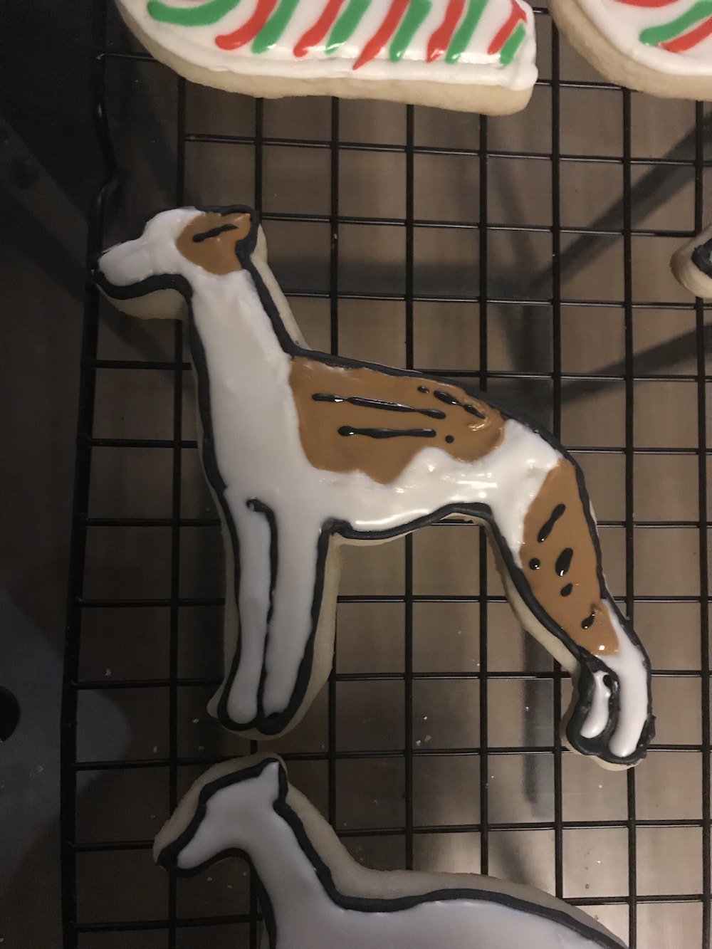 Marbling the whippet cookie icing to make a brindle patch